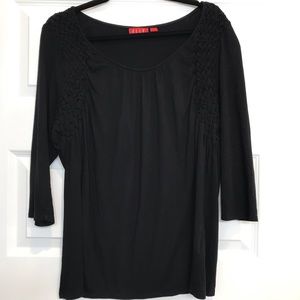 XL black top with detailing around shoulders